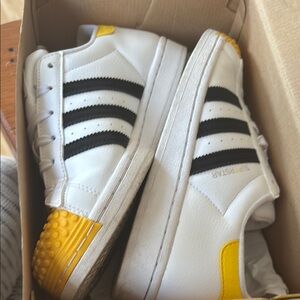 Adidas Superstar White Sneakers with Black and Yellow Highlights
